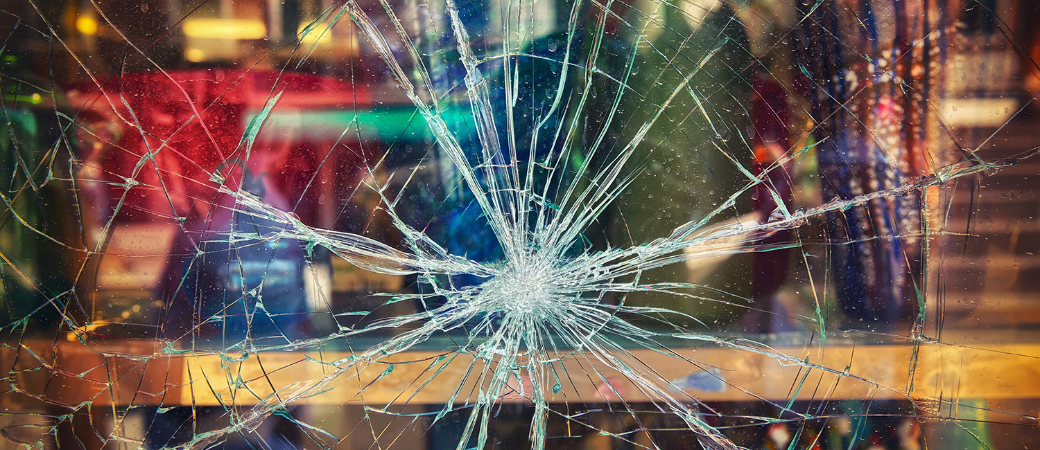 Glass that was hit by flying debris without safety window film