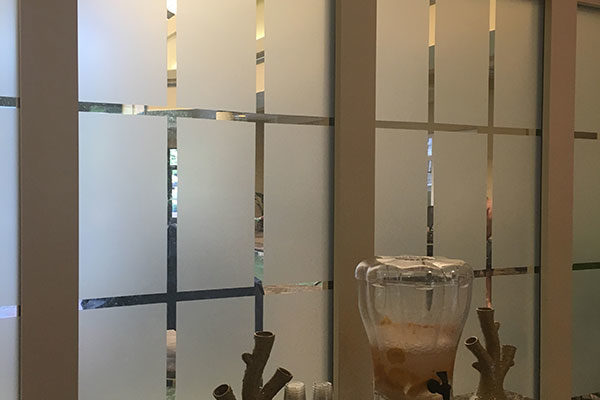 Decorative window film in a Mariott breakroom.