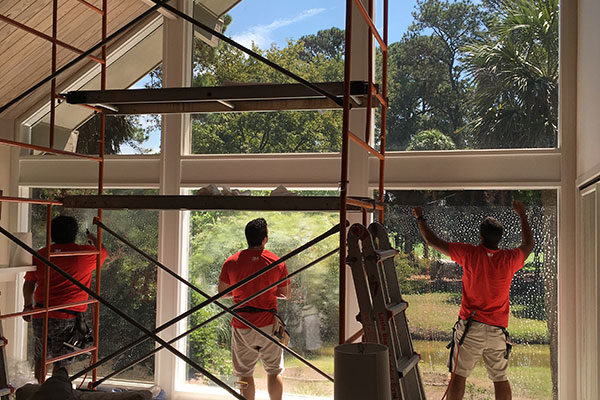 The Coastal Installations team installing window film.