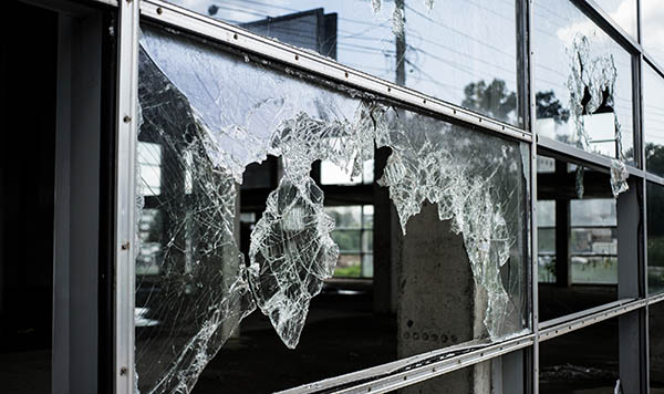 Broken glass from flying debris after a hurricane.